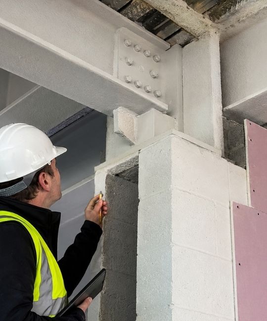 Structural Steel Fire Protection Inspection Interfaces IFI technician reviewing a Structural Steel Fire Protection Inspection interface